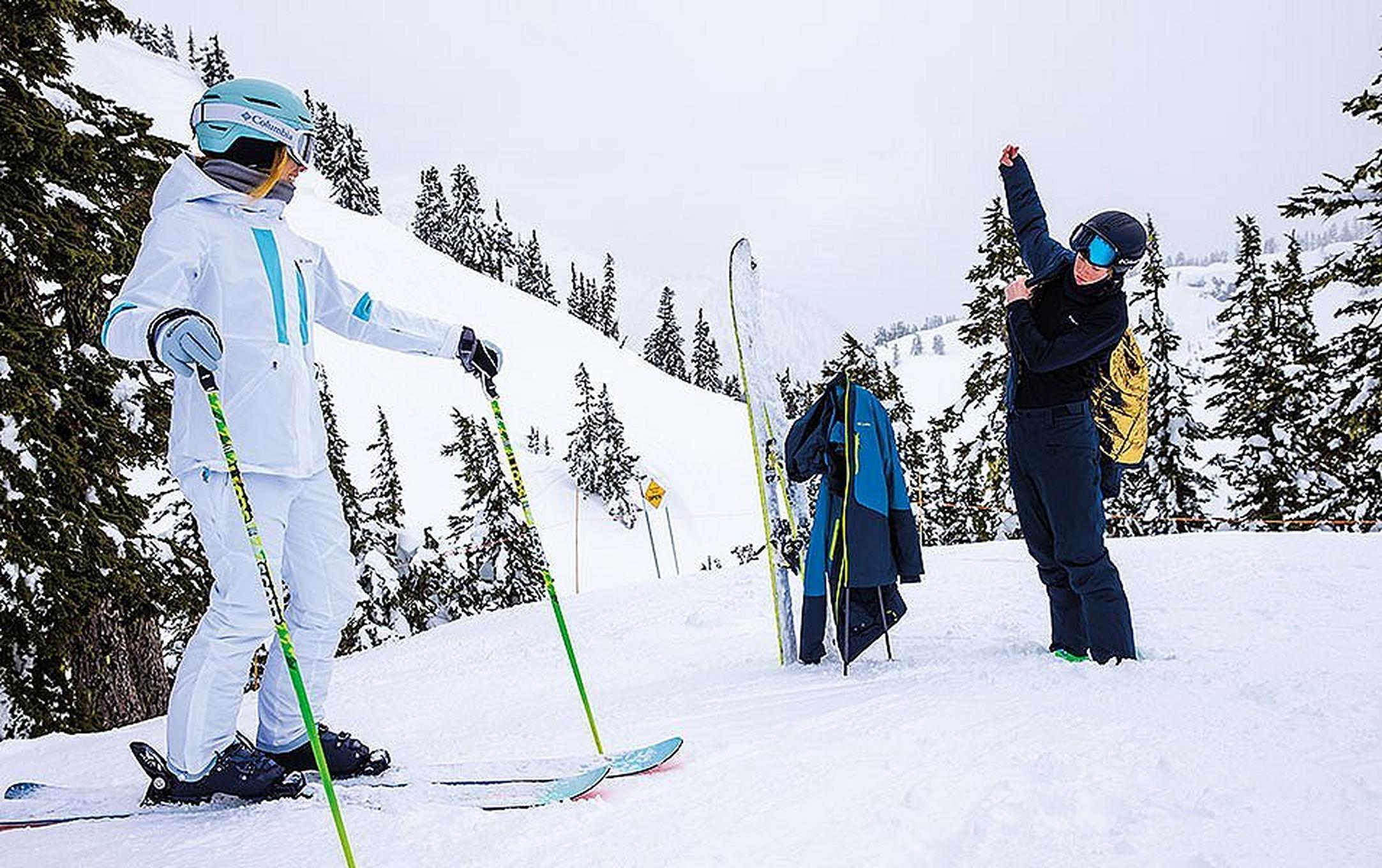 Skiers getting putting on gear.