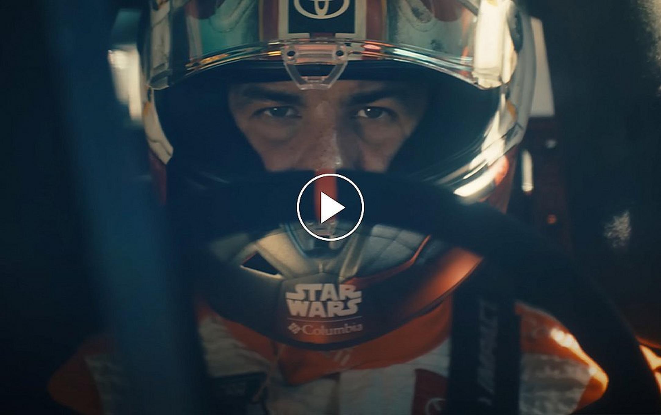 Video still of Bubba Wallace behind the wheel of the Columbia No. 23 X-wing Toyota. Play button.