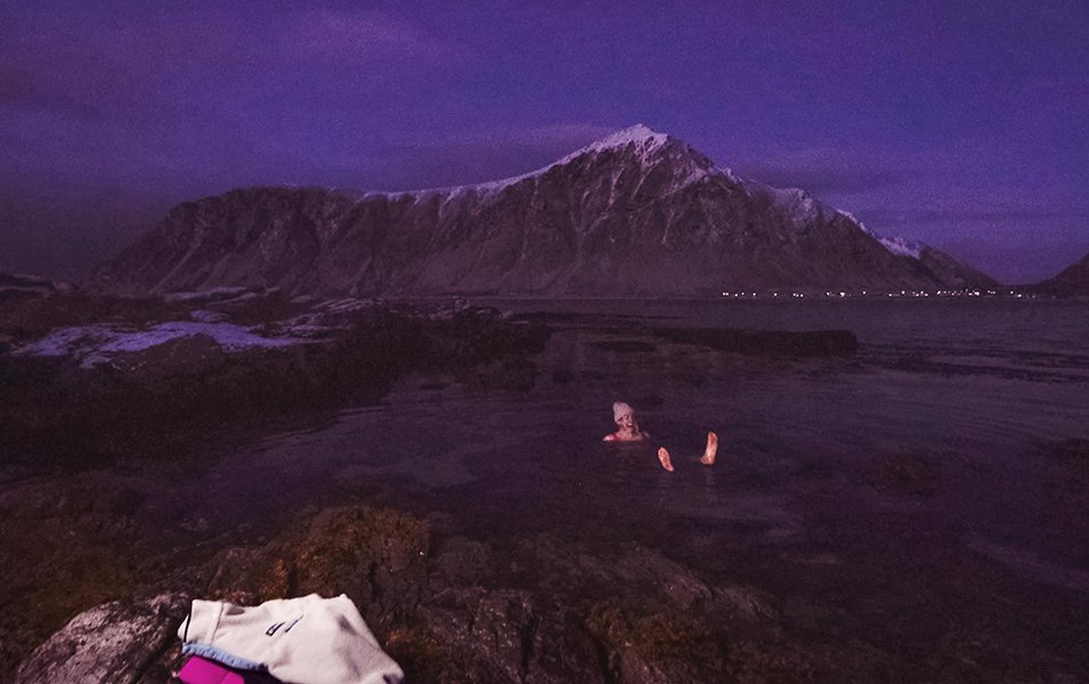 Rachel Pohl cold plunges in the icy ocean just after sunset.