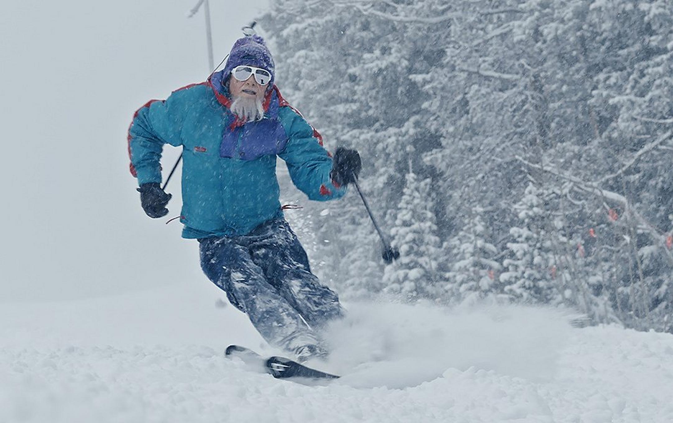 Hotdog Hans is pictured skiing down the mountain in Aspen wearing a vintage Columbia Sportswear jacket and denim jeans.