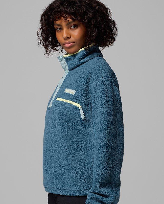A woman wearing a blue fleece pullover.