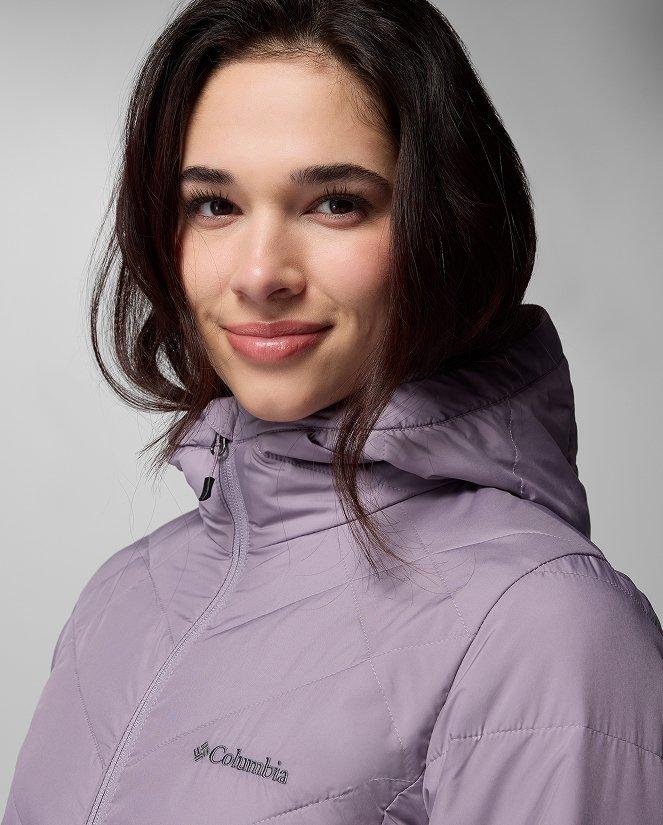 A woman wearing a light purple jacket.