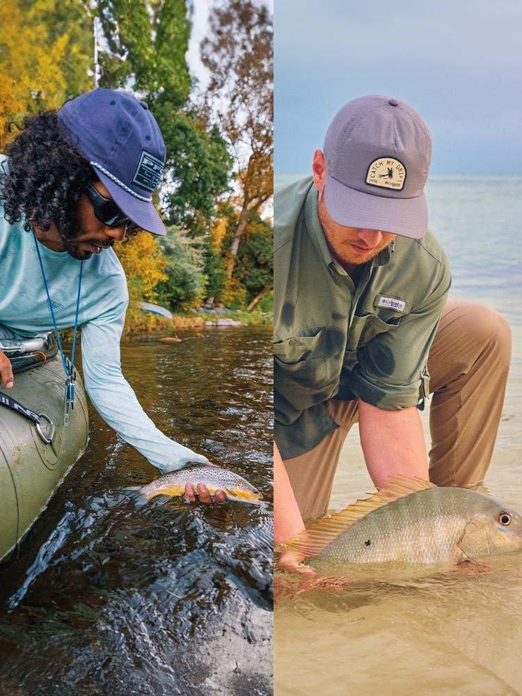 Two people holding their catch near the water; one is a saltwater fish and one is a fresh water fish