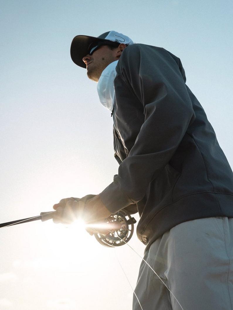 Man casting a fishing rod.