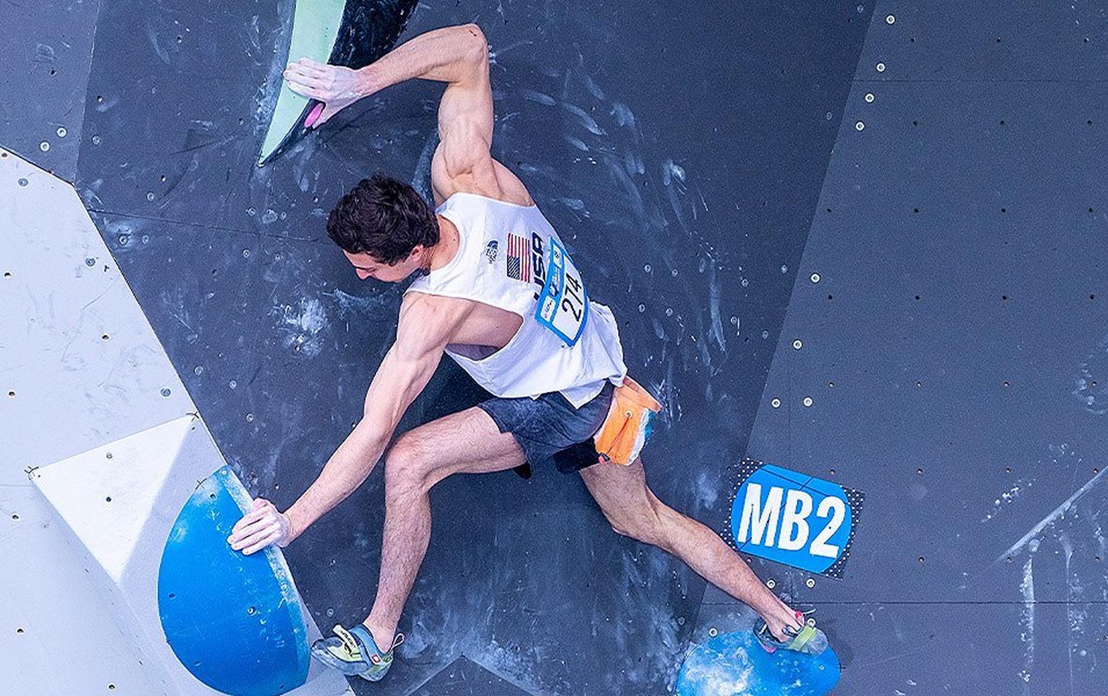 US Olympic Climbing Team member, Jesse Grupper, competing in World Cup bouldering competition.