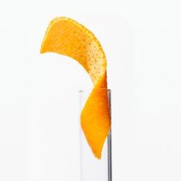 Orange peel being inserted into tube