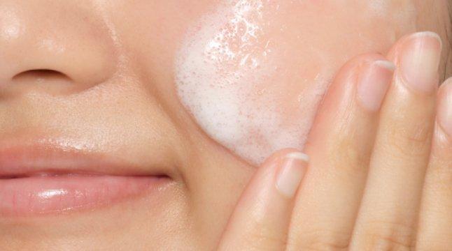 Person applying The Ordinary Product on face