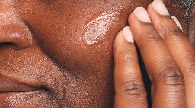 Person applying The Ordinary GF 15% Solution on face