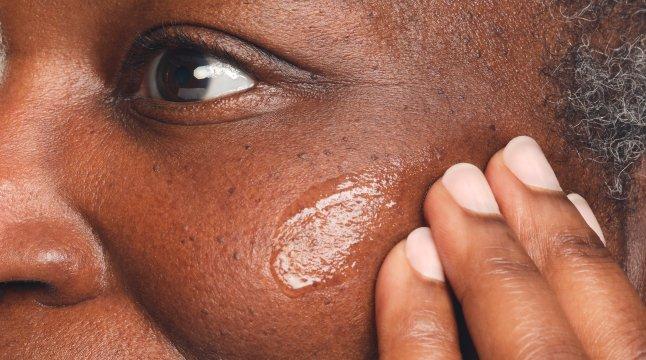 person applying The Ordinary GF 15% to face