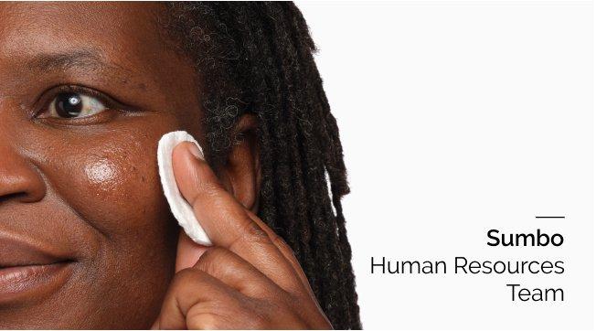 Person applying toner on skin