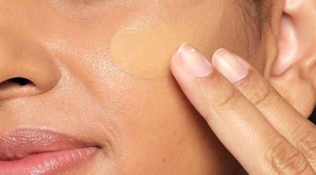 Person applying The Ordinary Serum Foundation on face