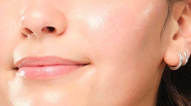Close up crop of model's face with hydrated healthy looking skin