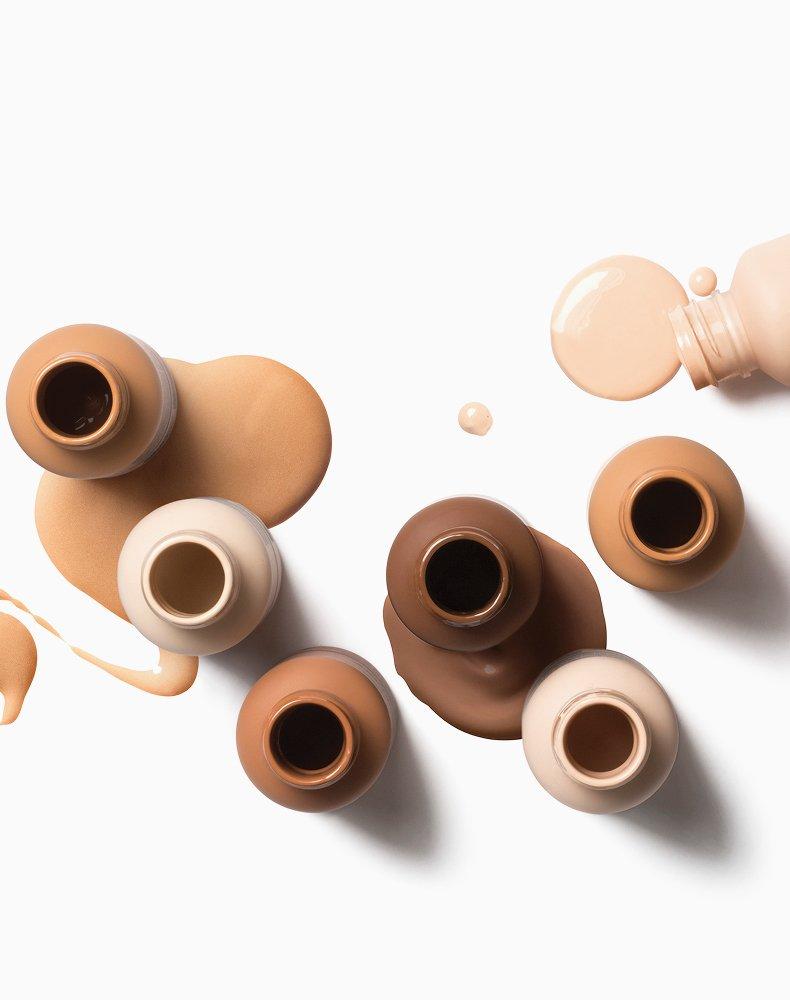 The Ordinary Serum Foundation swatches: Lightweight, natural-finish foundation for a "skinimalist" makeup look, showcasing shade diversity.