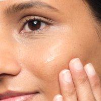 person applying The Ordinary serum to face