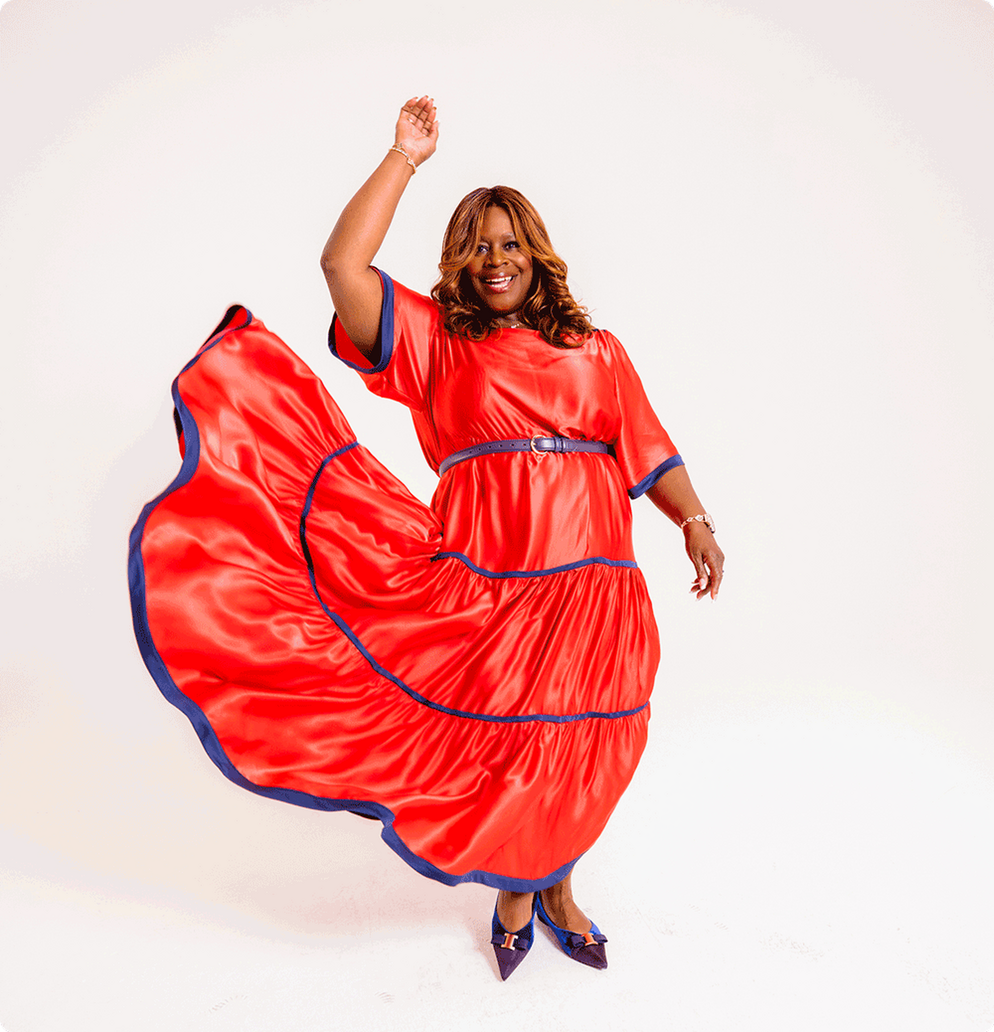 Retta wearing a red dress
