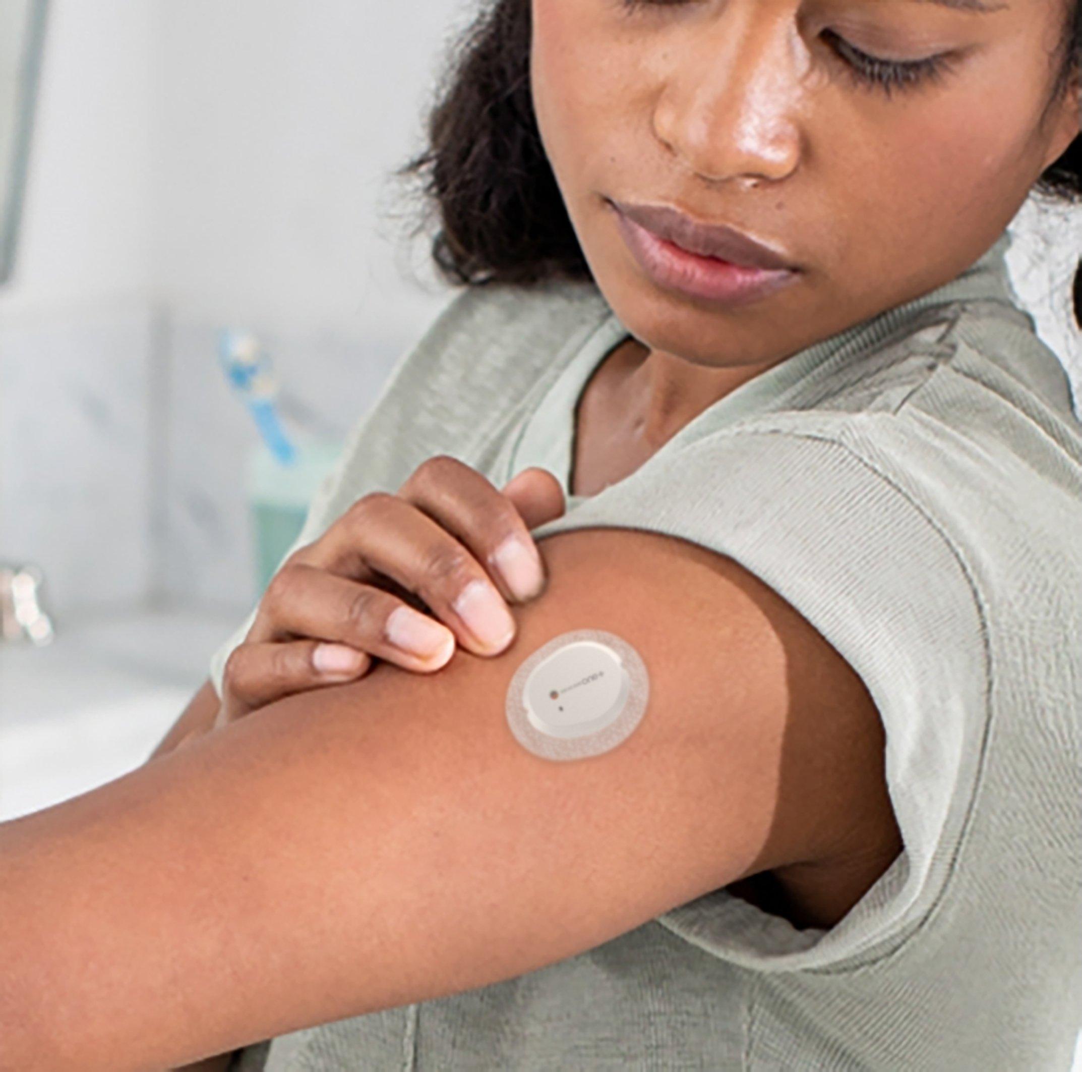 girl-looking-at-dexcom-one-plus-cgm