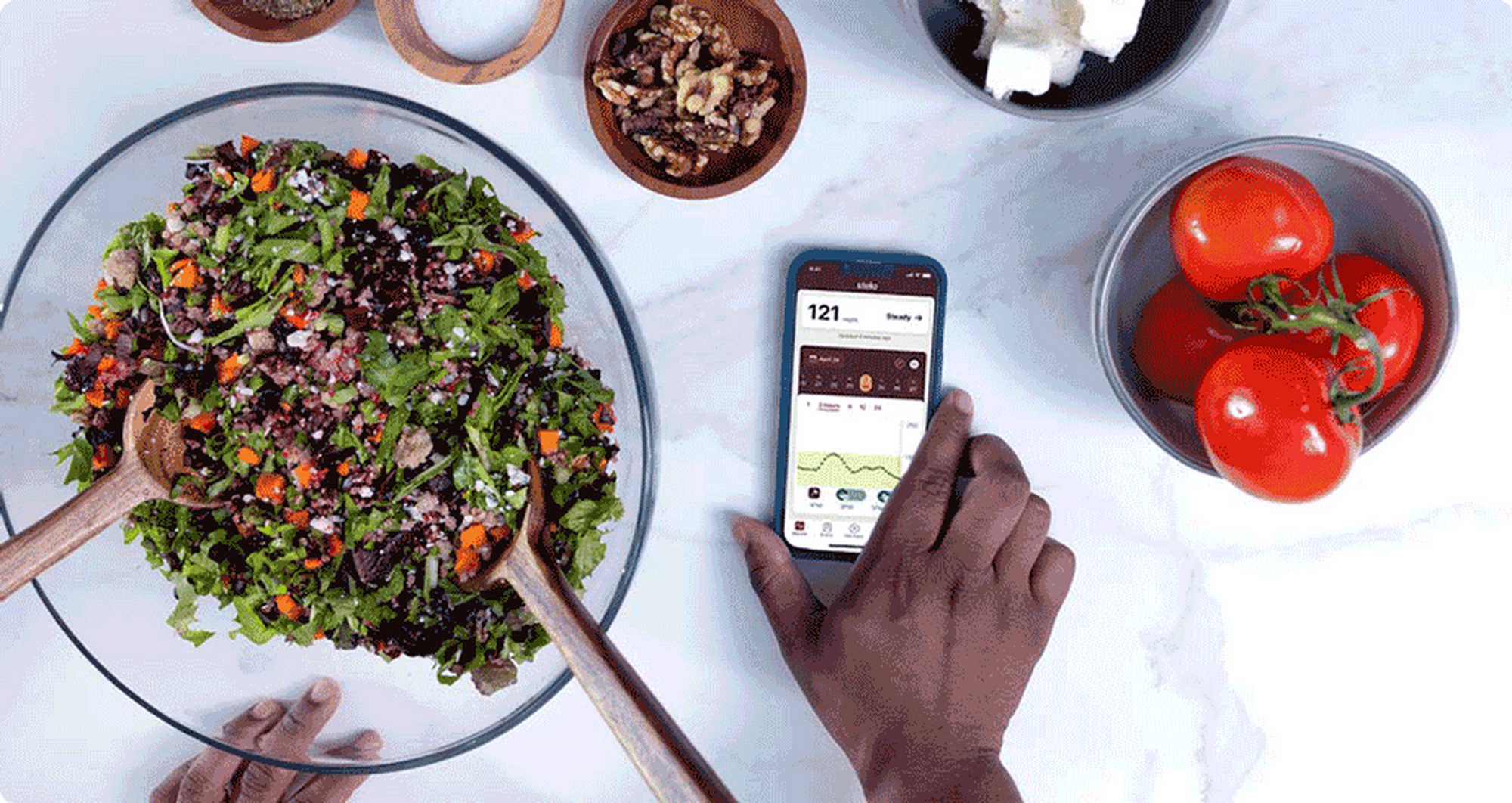 Looking at the stelo app while prepping a meal