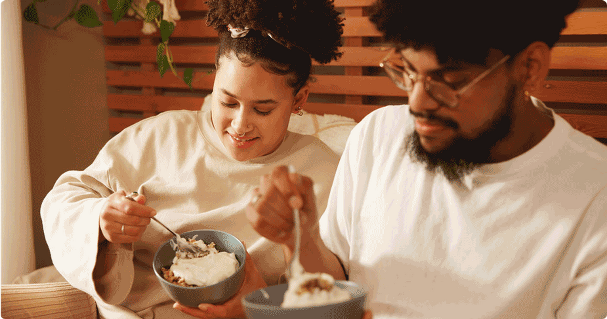 Woman and man eating a yogurt bowl