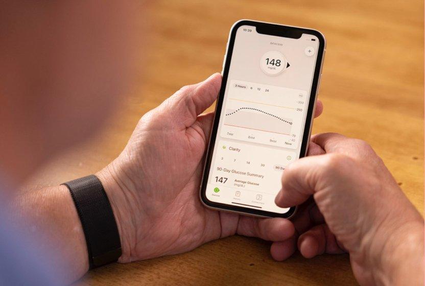 Hands holding smartphone with G7 App