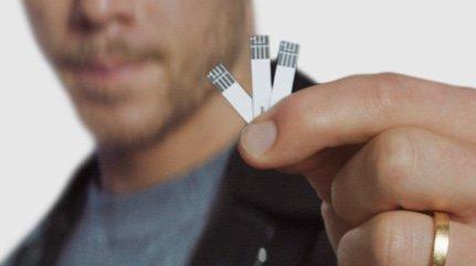 Nick Jonas holding out testing sticks