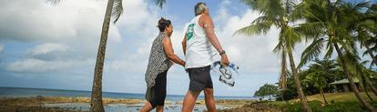 Man and woman walking on the beach
