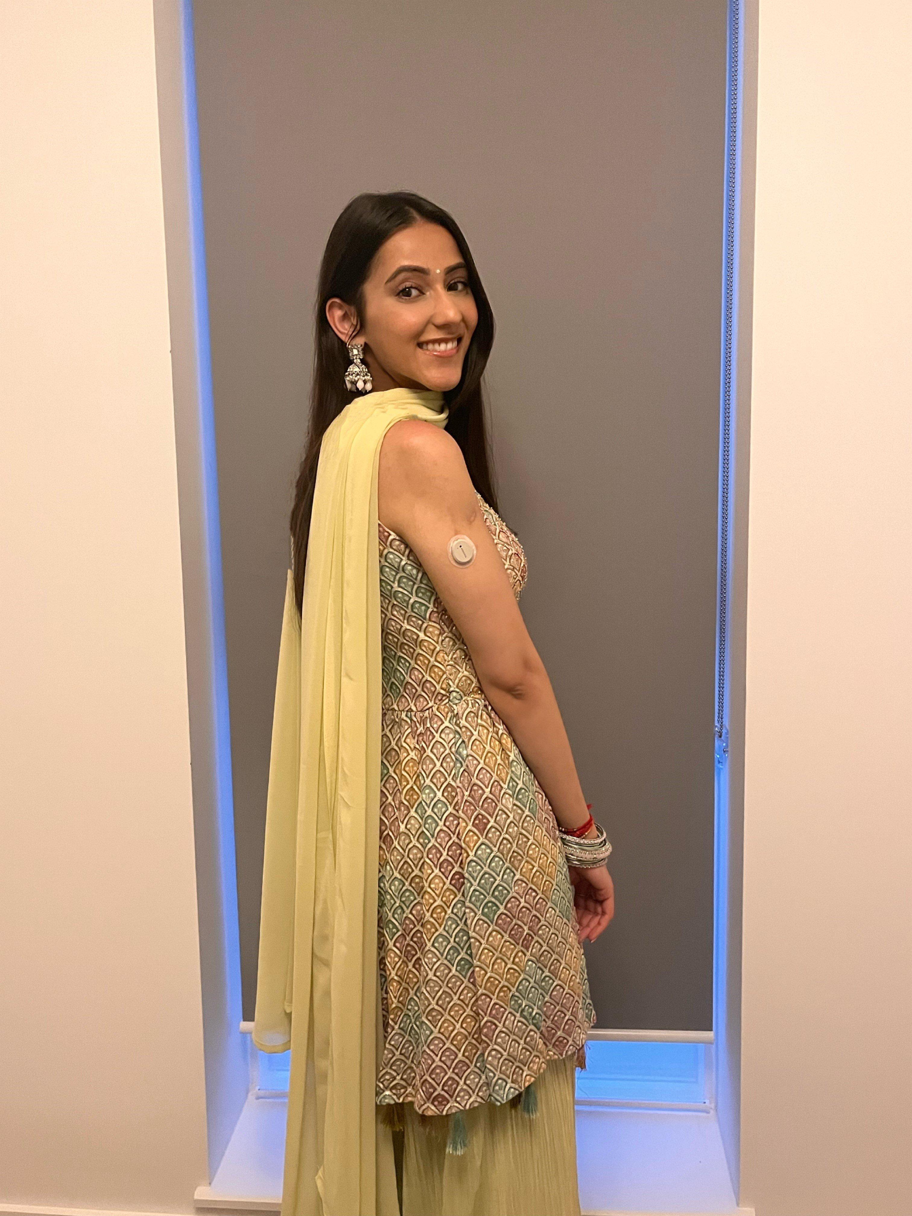 Woman wearing in sari wearing a diabetic patch