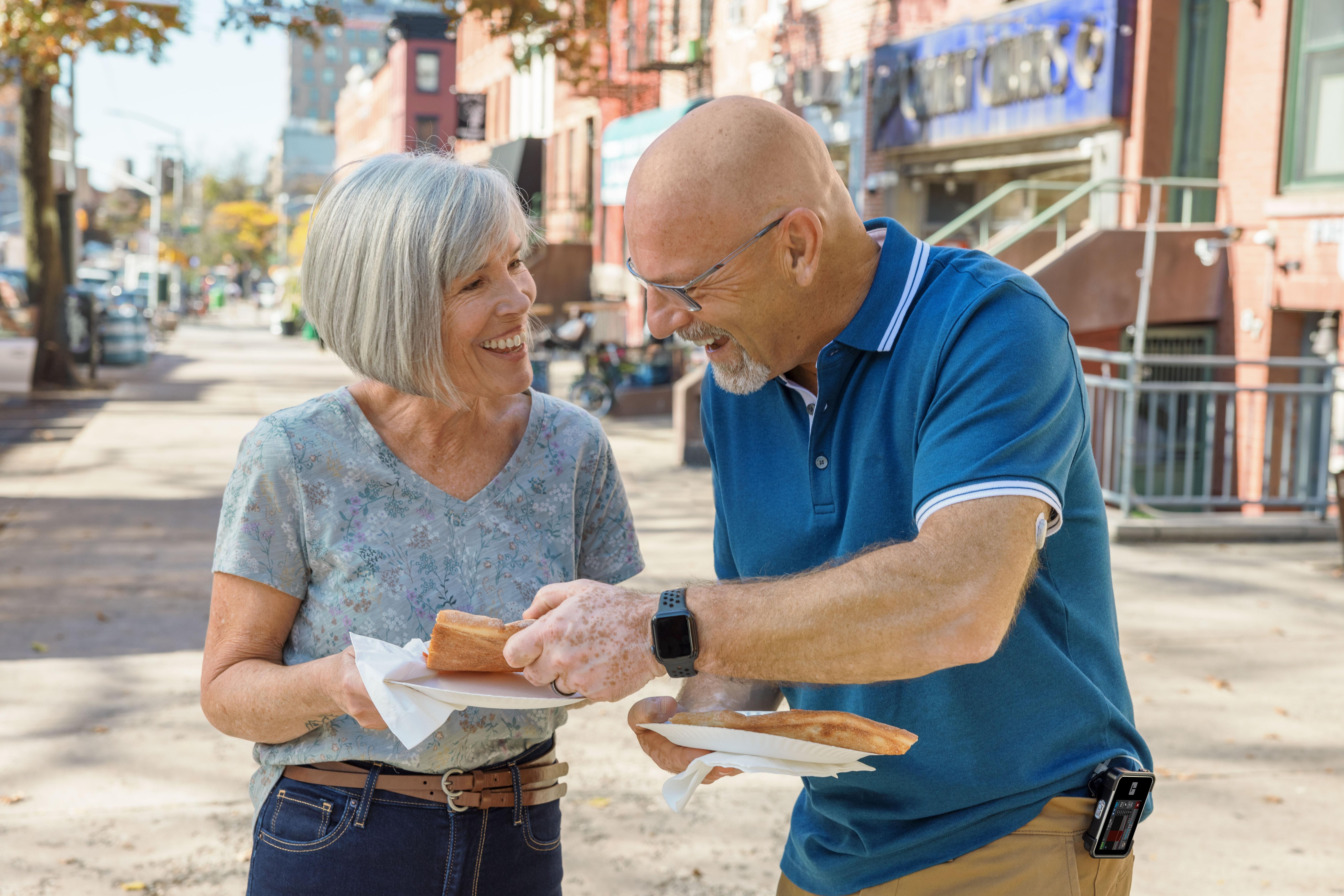 Couple enjoying lunch whilst using Dexcom CGM sensor