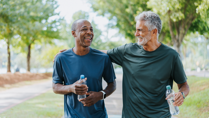 two men walking to help lower blood sugar