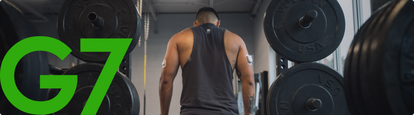 Man in gym with Dexcom G7 back of arm and Omnipod 5 insulin pump