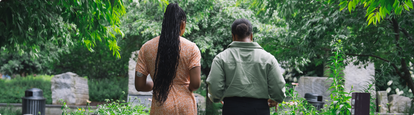 two women walking, one wearing a Dexcom sensor on their arm