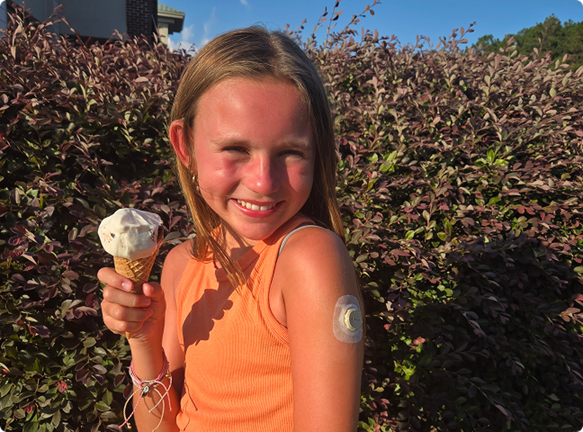 Girl eating ice-cream while wearing desxom patch
