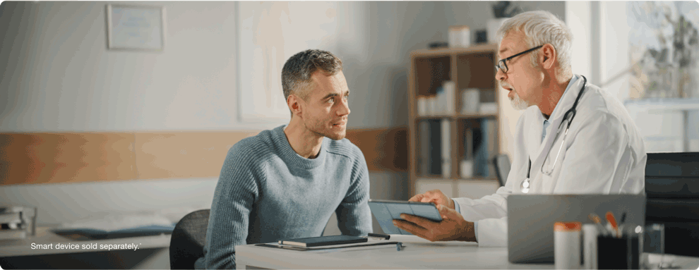 man talking to his doctor about preventing hypoglycemia unawareness