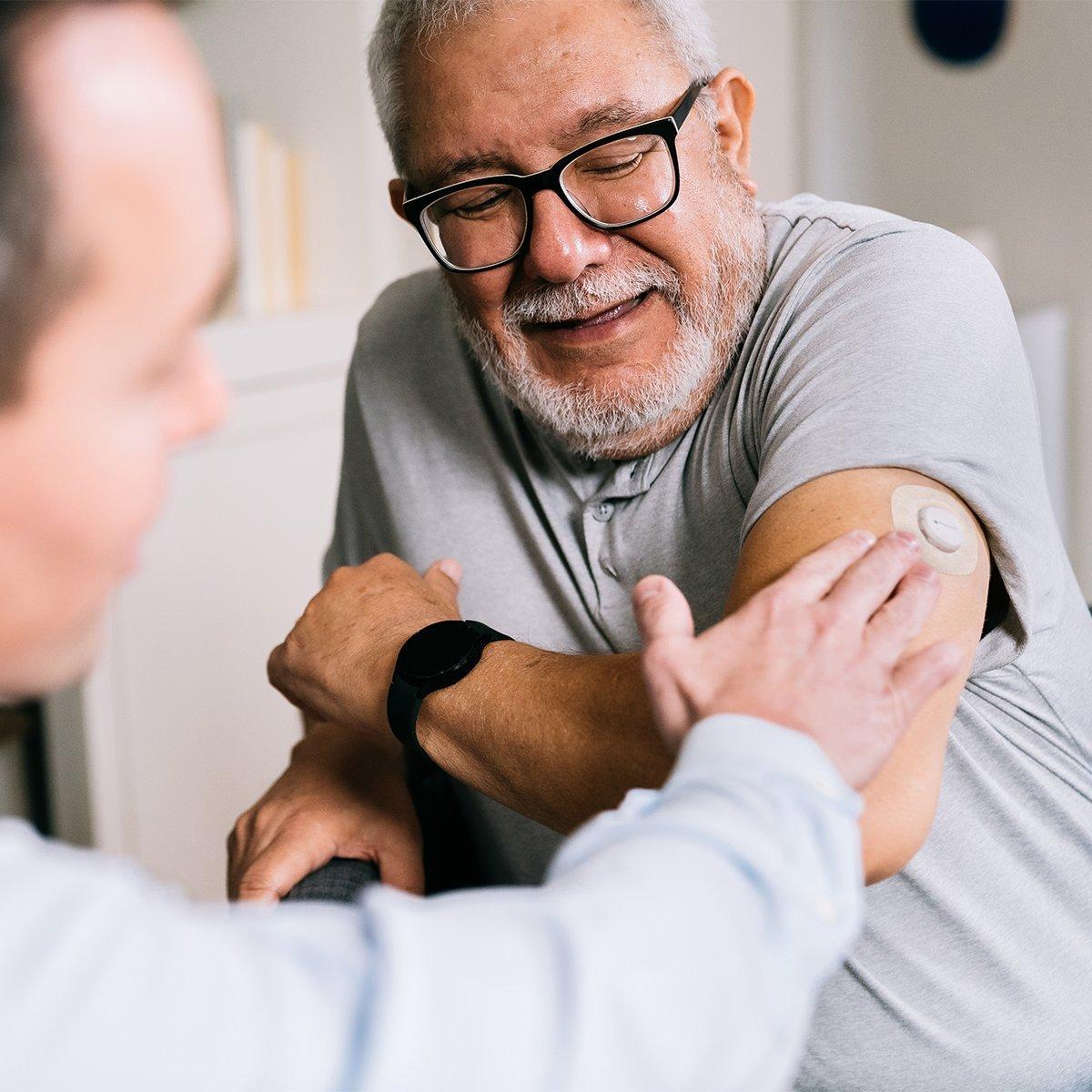 Dexcom G7 user in an office with a physician