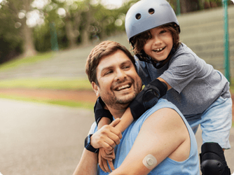 Father and child wearing Dexcom G7 sensor