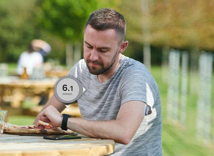 Man with diabetes checking his glucose readings