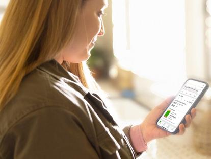 Woman looking at Clarity app on her phone