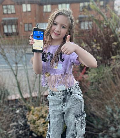 Ava, one of our Dexcom Warriors, using the Happy Bob App