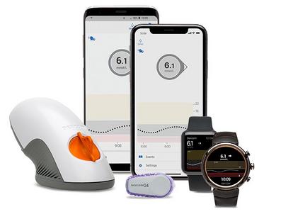 G6 devices with smartphones showing glucose readings
