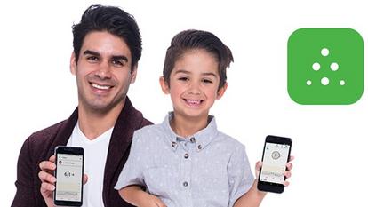 A man and a boy holding a Dexcom device