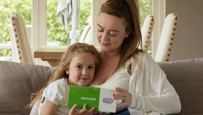 A mother and daughter with the Dexcom G6 CGM system