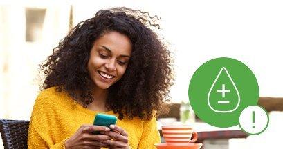 Woman using the Dexcom G6 app