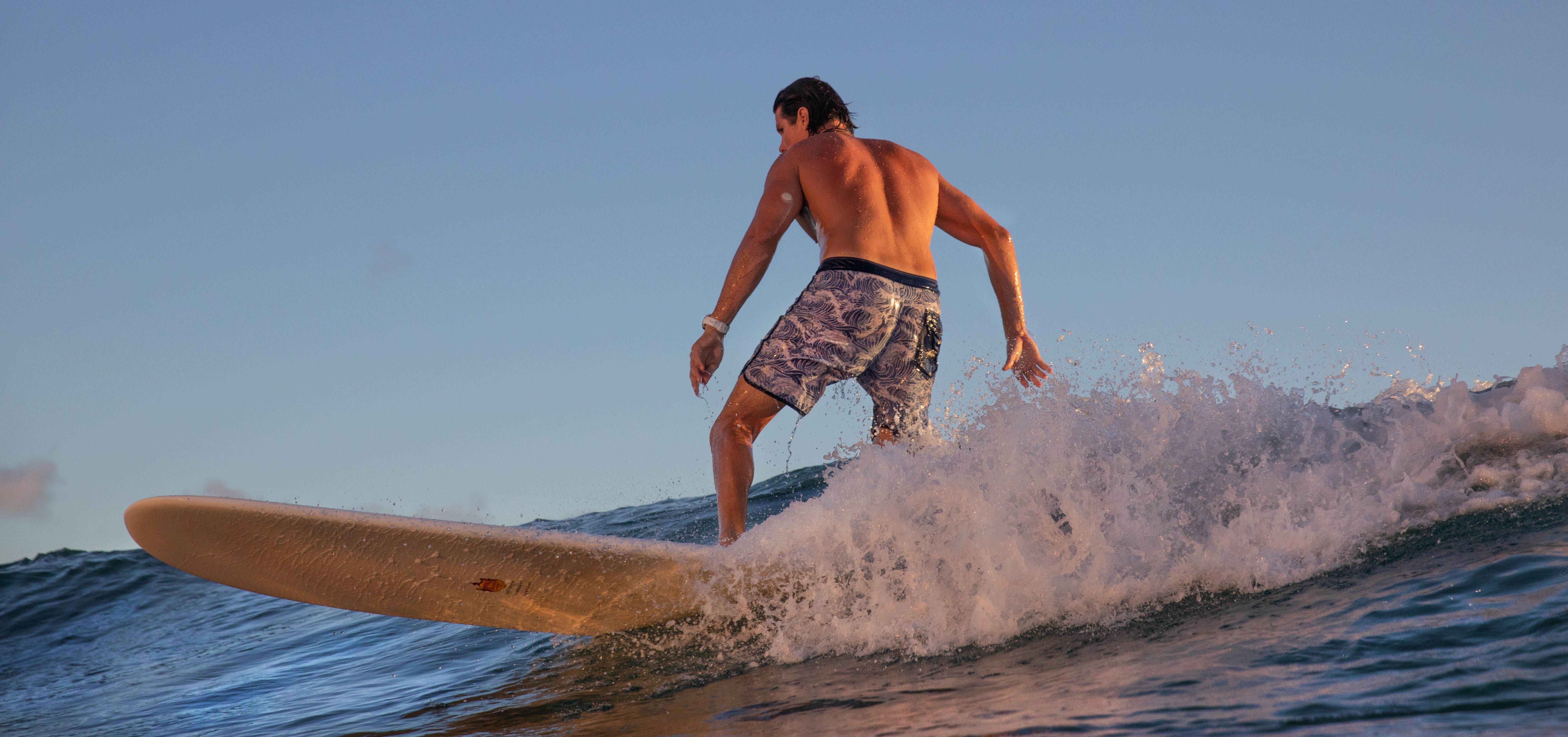 Man surfing while wearing the Dexcom G7