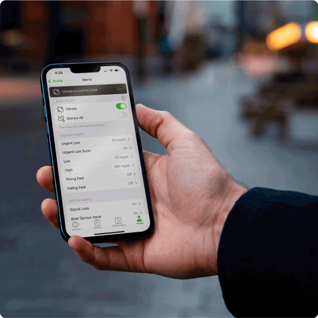 Man looking at alerts section in Dexcom App