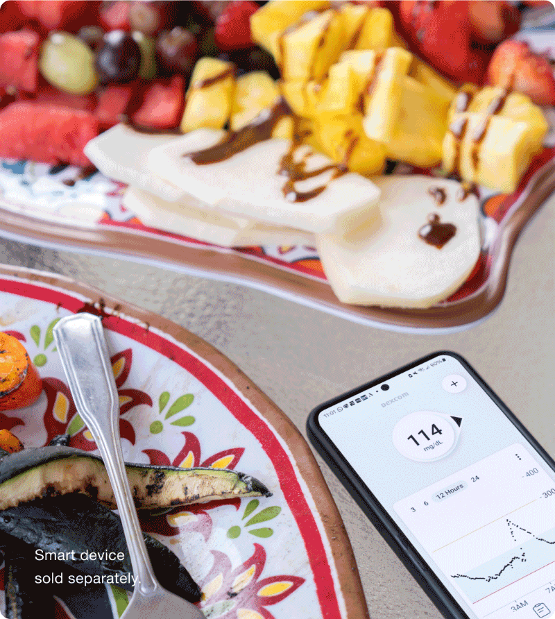 phone showing glucose readings on table