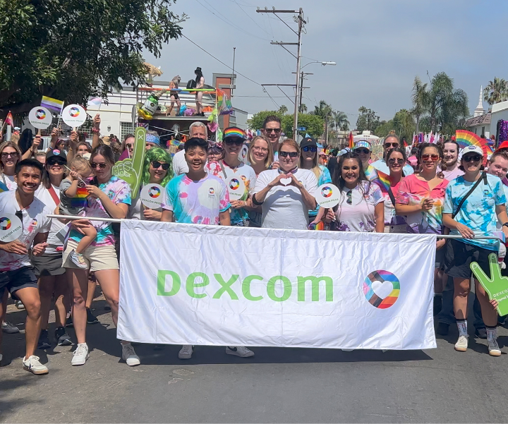 AMSL Diabetes Team standing infront of a sign that says "Believe Empower Change"