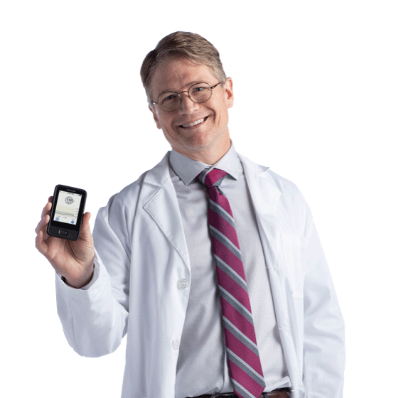 Headshot of Dr. Michael Heile holding Dexcom G6 device
