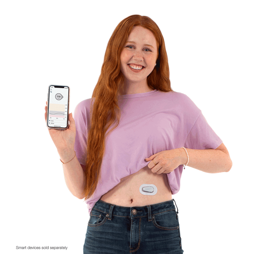 Headshot of Woman holding smartphone with Dexcom g6 App while wearing sensor on upper abdomen