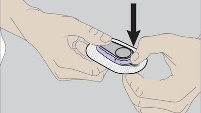 instruction diagram of someone removing transmitter from the holder