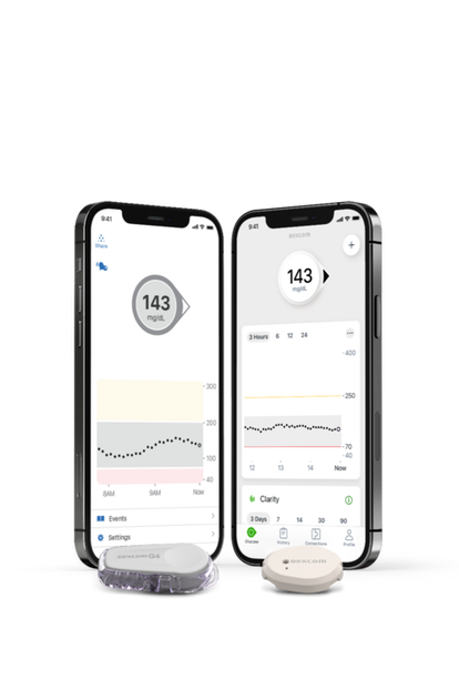 Smartphone displaying glucose reading next to Dexcom G6 sensor