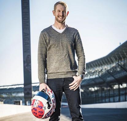 charlie holding race helmet